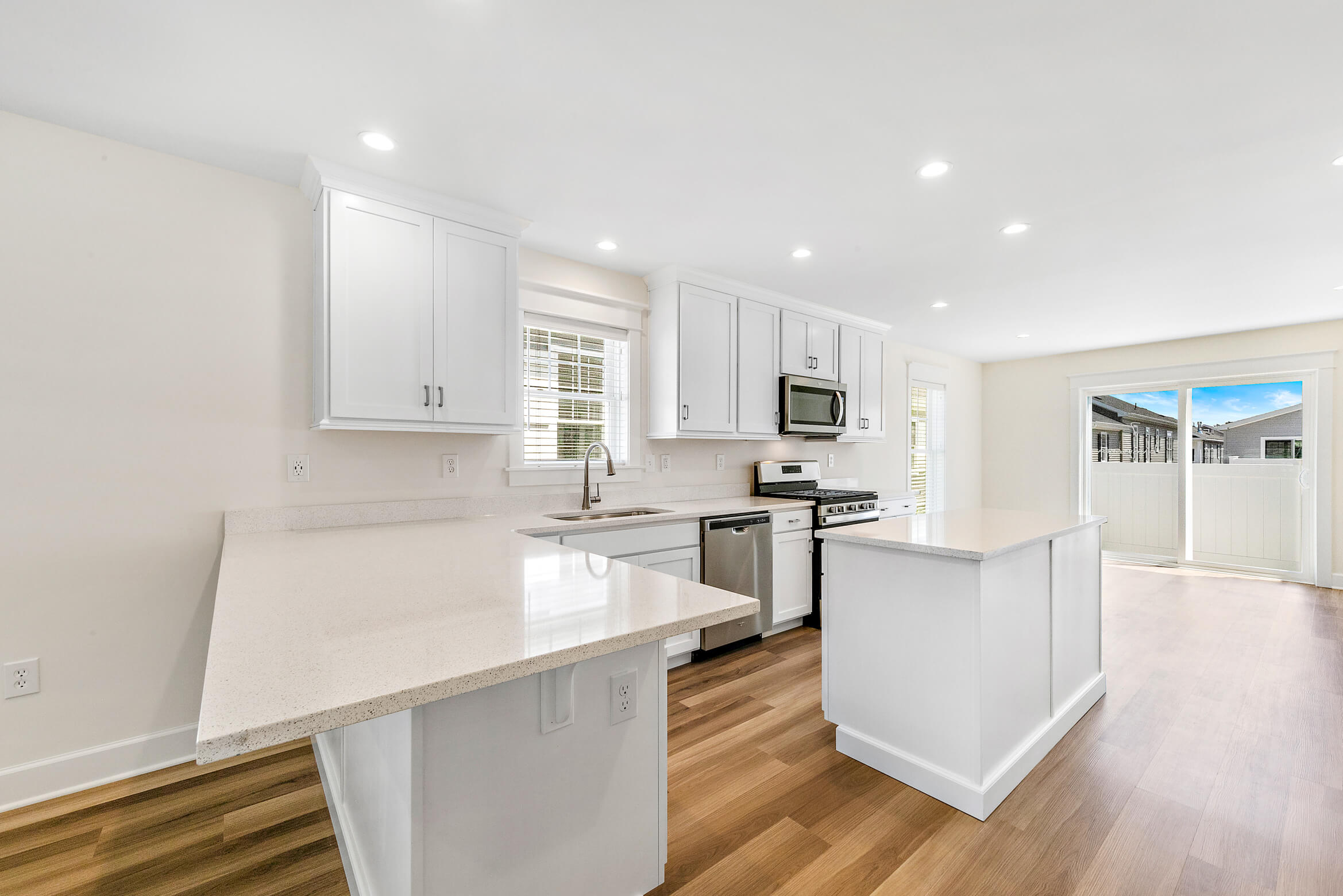 White kitchen peninsula and island
