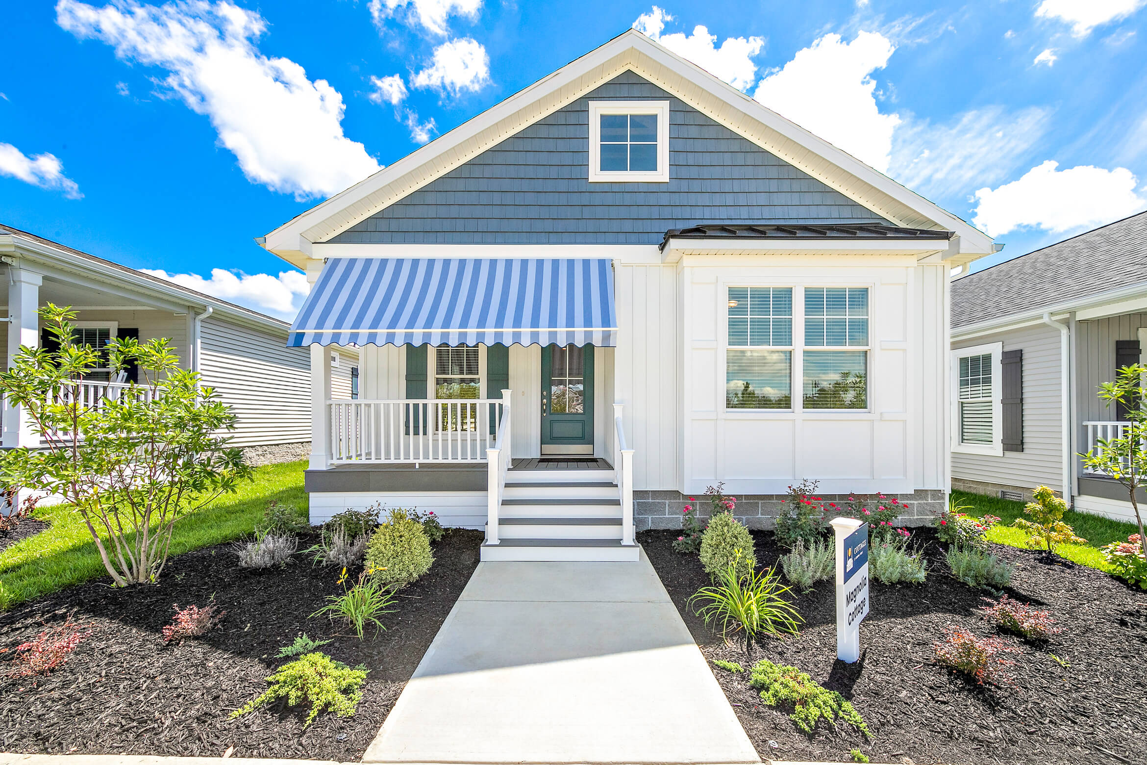 Magnolia cottage with a front porch awning
