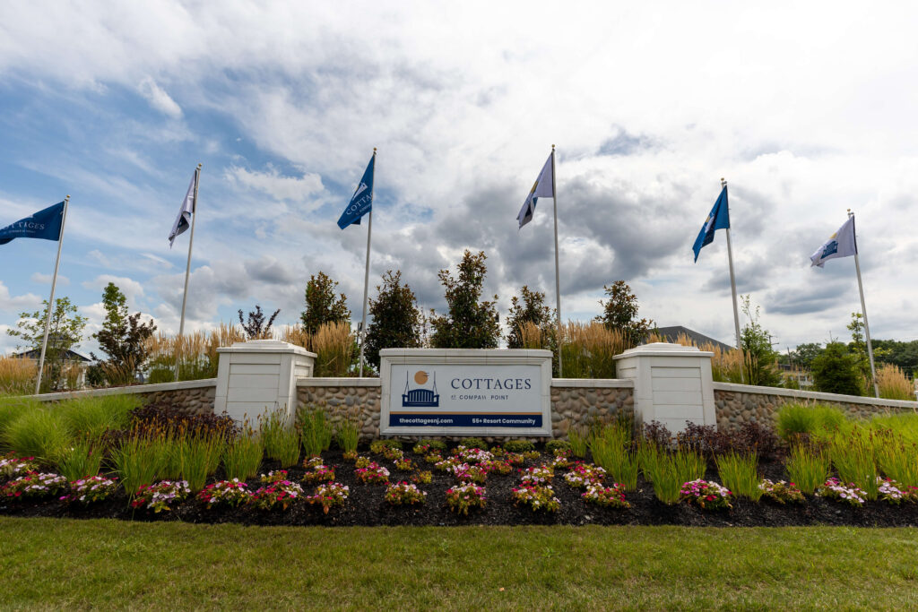 Welcome sign with flags